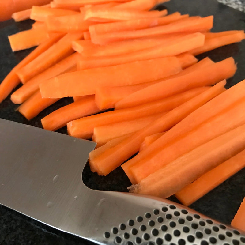 Chopped carrot on a chopping board